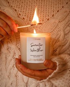 a person holding a lit candle in their hands with the words, generator weather written on it