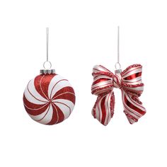 two red and white christmas ornaments hanging from strings with bows on them, isolated against a white background