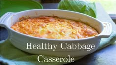 healthy cabbage casserole in a white dish on a green napkin with lettuce