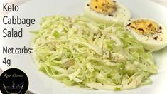 a white plate topped with cabbage and hard boiled eggs