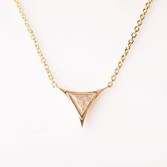 Triangle Pendant, Diamond Pendant, Art Deco Pendant, Triangle Diamond Pendant, Triangle Diamond, diamond pendant, gift, geometric pendantA handmade geometric triangle diamond pendant made in solid 14k gold and set with a triangular diamond.The Pendant is set with a single triangle diamond which gives it a beautiful, clean look.The pictured diamond is 0.2ct.----------------------DIMENSIONS----------------------This beautiful, delicate pendant is about 10mm wide, this would change depending on the Gold Diamond Triangle Jewelry, Gold Triangle Diamond Jewelry, Gold Trillion Cut Jewelry With Single Diamond, Trillion Cut Gold Jewelry With Single Diamond, Minimalist Trillion Cut Diamond Jewelry, Luxury Triangle Jewelry For Gifts, Gift Trillion Cut Single Diamond Jewelry, Trillion Cut Single Diamond Jewelry For Gift, Triangle Diamond