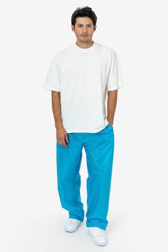 These lightweight nylon pants feature an extra wide, baggy straight leg fit. They feature 2 side pockets, 1 back pocket with velcro closure, and an elastic waistband with drawcord for an adjustable fit. These pants are unlined, making them super compact for traveling and versatile for different climates and weather needs. This fabric is great for maintaining body heat making these pants ideal for warm-ups and more. Please note: Lighter colors will have some transparency! We recommend pairing wit Nylon Pants, Wide Leg Pant, Body Heat, Neon Blue, Oversized Tee, Baggy Fits, White Undershirt, Wide Leg Pants, Mens Pants