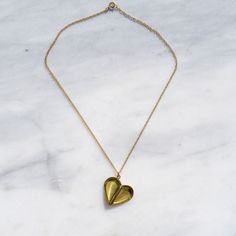 Vintage brass locket in raw brass strung on 14 kt gold fill chain. Assembled in Minneapolis. Eco Hair, Half Heart, Golden Family, Ceramic Fiber, Oval Locket, Hair Shop, Heart Locket, Gold Filled Chain, Raw Brass