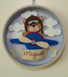 a blue and white plate with a teddy bear on it's wings in the sky