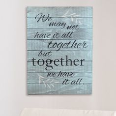 a wooden sign that says we may not have it all together but together we have it all