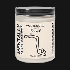 a white jar with the words monte carlo and david on it's lid, in front of a black background