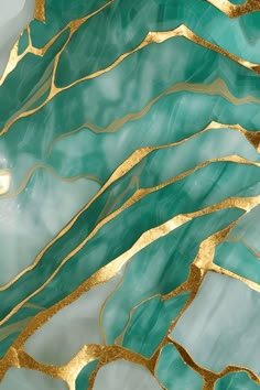 an abstract painting with gold and green paint on it's surface, in the shape of waves