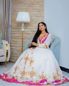 The Habesha dress, also known as Habesha Kemis, is a sparkling example of Ethiopian traditional dress. Perfect for weddings, this stunning pink dress features shimmering accents, highlighting the elegance and cultural richness of Ethiopian attire. Material Cotton Menen Thread Estimated delivery : 1 week to 2 weeks Contact WhatsApp +1(304)-306-2784Email: contact@ethiopian.store Habesha Wedding Dress, Ethiopian Wedding Dress, Habesha Wedding, Ethiopian Wedding, Habesha Dress, Ethiopian Traditional Dress, Habesha Kemis, Wedding Dresses Simple, Inspired Dress