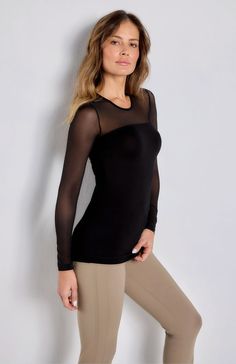 Our bestselling long-sleeve top is crafted of our signature luxe jersey and beautifully contrasted by the mesh sleeves and yoke. Slim fit Mesh sleeves and yoke Hits slightly below waist Chic Black Long Sleeve Top With Sheer Sleeves, Elegant Long Sleeve Top With Sheer Stretch Sleeves, Elegant Long Sleeve Mesh Tops, Evening Mesh Top With Long Sleeves, Long Sleeve Tops With Mesh Sleeves For Evening, Evening Tops With Mesh Long Sleeves, Evening Tops With Long Mesh Sleeves, Elegant Tops With Long Mesh Sleeves, Elegant Fitted Top With Mesh Sleeves