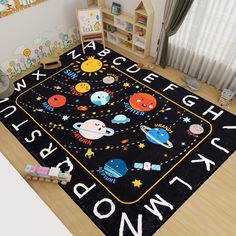 a child's rug with space and stars on it in the middle of a room