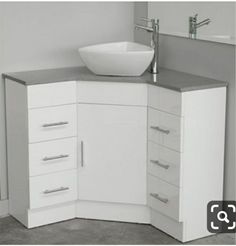 a white sink sitting on top of a counter