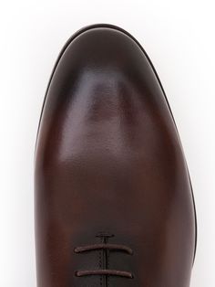 Color: brown Caw leather with natural finish Leather insoles Rubber and leather soles Traditional lace-up closure Hand-stitched detailing Classic Brown Closed Toe Lace-up Shoes, Brown Calf Leather Lace-up Shoes With Textured Sole, Timeless Brown Lace-up Shoes With Rubber Sole, Brown Lace-up Shoes With Textured Sole For Derby, Brown Wingtip Lace-up Shoes With Leather Lining, Brown Cap Toe Lace-up Shoes With Leather Sole, Cognac Oxfords With Leather Sole For Business, Business Cognac Oxfords With Leather Sole, Brown Calf Leather Lace-up Shoes With Almond Toe