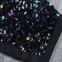 Show off your sparkling personality with our Sequin Crop Top! This top is perfect for adding a touch of glamour to any outfit. With its eye-catching sequin design, you'll be turning heads wherever you go. Embrace your inner diva and shine bright in our Sequin Crop Top! Black Sequin Dress With Contrast For Party Season, Black Contrast Sequin Dress For Party Season, Glamorous Contrast Sequin Fabric For Club, Glamorous Glitter Sequin Fabric For Club, Glamorous Black Sequin Fabric With Contrast Sequin, Fitted Black Sequin Fabric For Summer, Disco Style Sequin Fabric For Club, Black Embellished Sequin Fabric, Glamorous Style, Black Glamorous Sequin Fabric With Contrast Sequin