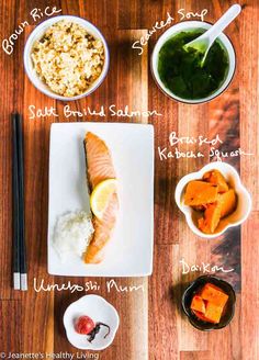 the ingredients to make salmon sushi on a cutting board