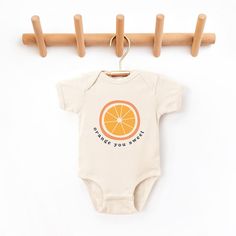 The perfect bodysuit for your perfect baby! These short sleeve bodysuits have 3 snap closure and double needle ribbed binding on neck, shoulders, sleeves, and leg openings. Machine wash cold, inside out. Air dry or tumble dry low. Playful Orange Cotton Onesie, Cute Orange Cotton Onesie, Sweet Cotton Onesie For Playtime, Citrus Party, Watermelon Baby, One Piece Clothing, Retro Baby, Gerber Baby, Hudson Baby