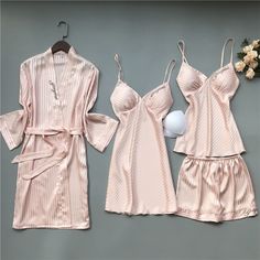 Sleep like royalty in our 4 Piece Nightwear Solid Color Stripes Set. This collection features a comfortable nightshirt, coordinating shorts, and a soft robe. Unwind in style and comfort, and experience the perfect blend of fashion and relaxation. Pamper yourself with the utmost comfort and sophistication. Specifications: Each of the sleepwear is sourced from the finest quality fabric, sewn together by quality workmanship. Made with cotton, lycra, and dacron material Unshrinkable, wrinkle-resista Red Summer Sleepwear For Loungewear, Red Summer Loungewear Sleepwear, Red Summer Sleepwear For Night, Summer V-neck Night Robe, Summer Night V-neck Robe, Pink Summer Robe For Bedtime, Summer Pink Robe For Bedtime, Elegant Summer Sleepwear For Loungewear, Elegant Summer Loungewear Sleepwear