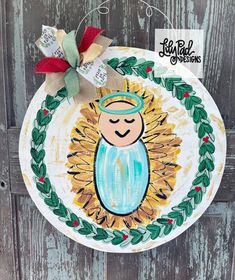 a paper plate with an image of a baby jesus on it