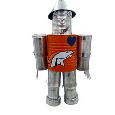 a tin can robot is wearing a hat