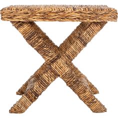 a wicker table with an x design on the top and two legs that are made out of wood