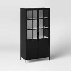 a black cabinet with glass doors and shelves