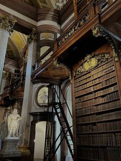 an old library with many wooden bookshelves