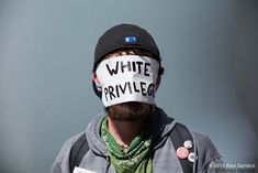 a man is wearing a mask with the words white privacy written on it