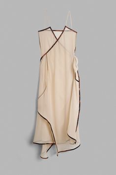 Semi-sheer silk laced-up long dress with straps. 100% Silk. V-NECK TIE SILK DRESS BEIRA SIZE 1 2 3 CHEST 86 cm 33,8 in 88 cm 34,6 in 90 cm 35,4 in HIP 99 cm 38,9 in 101 cm 39,7 in 103 cm 40,5 in LENGTH 139 cm 54,7 in 139 cm 54,7 in 139 cm 54,7 in STRAP 38 cm 14,9 in 38 cm 14,9 in 38 cm 14,9 in MINIMUM OVERLAP OF THE TIE 94 cm 37 in 94 cm 37 in 94 cm 37 in Summer Silk Wrap Dress With Tie Waist, Silk Wrap Dress With Tie Waist For Summer, Spring Silk Wrap Maxi Dress, Silk Wrap Maxi Dress For Spring, Sheer Sleeveless Silk Maxi Dress, Sleeveless Sheer Silk Maxi Dress, Silk Wrap Dress For The Beach, Chic Maxi Dresses With Wrap-around Straps, Silk Wrap Beach Dress