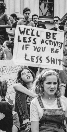 black and white photograph of people holding protest signs