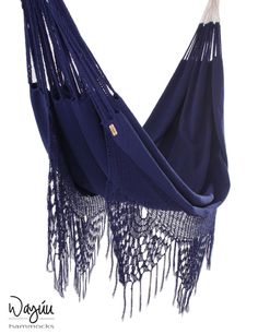 a blue hammock with fringes hanging from it's side and the bottom half