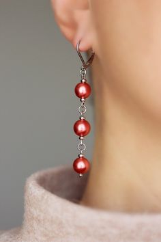 Unique pearl earrings with bright red-pink high quality czech glass pearl coated 8 mm beads, tiny stainless steel beads-separators, steel jumping ringa and stainless steel lever back earring hooks. Earring hooks are from nickel free and lead free metal. The total lenght of earrings is about 65 mm including earring hooks. Perfect jewelry for everyday wear and a great gift! Other earrings of my shop you can see here: https://www.etsy.com/shop/NaTavelli?section_id=13757927 Thanks for visit! Red Dangle Pearl Earrings For Party, Red Pearl Drop Earrings For Party, Red Round Pearl Drop Earrings, Red Pearl Dangle Jewelry, Red Pearl Drop Round Earrings, Red Pearl Drop Earrings For Formal Occasions, Red Pearl Drop Earrings, Handmade Red Pearl Earrings For Party, Red Drop Pearl Earrings For Gift