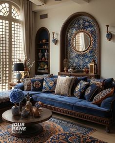 a living room filled with blue couches and pillows