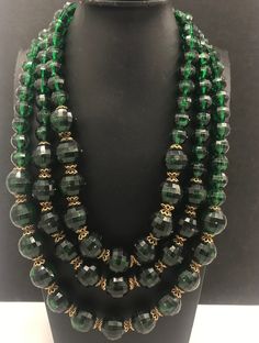 Chunky Green Necklace, Huge Lucite Rhinestone Necklace, 3 Strand Necklace, 1960's Vintage Jewelry Style: 1960's Glam Huge green rhinestone clasp Color: gold tone metal, green stones Size: 20 inches long  Condition: Very good vintage condition Approximate Date: 1960's Hallmarks/signature: None For more vintage necklaces.... http://etsy.me/1RY2UxM For more jewelry & collectibles.... www.etsy.com/shop/MartiniMermaid d96 Luxury Vintage Necklaces With Large Beads, Luxury Green Necklace For Collectors, Luxury Green Beaded Necklaces For Party, Luxury Green Costume Jewelry Necklaces, Luxury Green Beaded Necklace For Parties, Luxury Tarnish Resistant Green Necklace, Luxury Formal Rondelle Beaded Necklaces, Luxury Green Beaded Necklaces For Celebration, Luxury Green Collectible Necklace