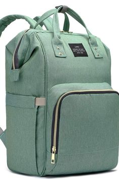 a green backpack with two zippers on the front