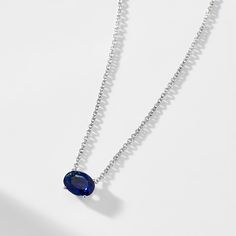 A modern classic, this brilliant oval shaped east-west solitaire faux sapphire necklace brings the perfect touch of sparkle to any neckline. ABOUT THE PRODUCT Metal: Sterling SilverPlating: RhodiumStones: Simulated Sapphire-Colored Gemstone, 8mm x 6mm (approx. diamond equivalent weight 1.25 ct)Chain Length: 16 in + 2 in extender Modern Blue Oval Necklace, Modern Sapphire Jewelry In Oval Shape, Modern Sapphire Jewelry With Oval Shape, Oval Solitaire Necklace In Sterling Silver, Modern Sapphire Oval Jewelry, Modern Oval Sapphire Jewelry, Solitaire Necklace, Sapphire Solitaire, Star Sapphire