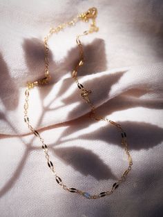 A super sparkly basic chain your gold necklace collection, our delicate gold dapped chain is the perfect everyday necklace. Made from 14kt Gold Filled, this versatile chain is the perfect layering essential.✦ DETAILS ✦✧ Name: Hokupa'a (hoo KOO leh) - star wreath.✧ 14kt Gold Filled.✧ All Ke Aloha Jewelry pieces come packaged thoughtfully, beautifully, and ready for gift giving.✧ Unless otherwise noted in the listing description, all pieces are sold individually. Photos with models/multiple pieces Star Wreath, Gemstone Hoop Earrings, Necklace Collection, Gold Filled Hoops, Leh, Everyday Necklace, Earrings Collection, Gold Hoops, Delicate Necklace