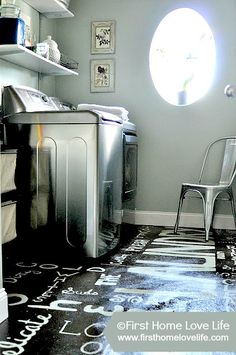 a laundry room with a washer and dryer next to a window that has the words home love life written on it