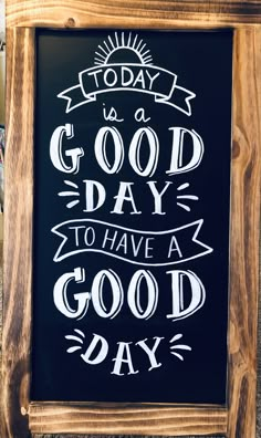 a chalkboard sign that says today is a good day to have a good day