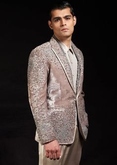 Our silk velvet jacket has been machine embroidered at base with metallic threads and jeweled with hematite's and silver crystals. Embroidery Details: Our Silk Velvet Jacket Has Been Machine Embroidered At Base With Metallic Threads And Jeweled With Hematite's And Silver Crystals. Fitted Embellished Outerwear For Reception, Embellished Velvet Party Sets, Formal Silver Sets With Intricate Embroidery, Embroidered Silk Sherwani For Party, Party Silk Sherwani With Embroidery, Embellished Raw Silk Sets For Formal Occasions, Party Silk Embroidered Sherwani, Luxury Embellished Outerwear For Weddings, Formal Embellished Raw Silk Sets