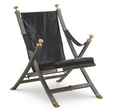 a black leather folding chair with two brass handles and an arm rests on a white background