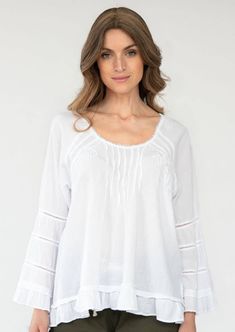 We're loving the look of this top. It's made of soft Peruvian cotton embellished with tonal crochet trims, subtle embroidery, and tiny pleats as a nice accent. The A-shape silhouette gives you a Bohemian look. Subtle Embroidery, Shape Silhouette, Apothecary Candles, Bohemian Look, Crochet Trim, Cotton Top, Cotton Tops, Jacket Dress, Sweater Top