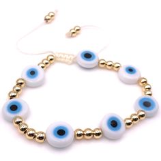 "Evil Eye White Beads Bracelet This is a Handmade Bracelet. Features Glass Bead Diameter: 0.3\" Inches/1cm, 7 Flat round white evil eyes separated with a 4 mm Gold Plated balls over 1 mm white nylon cotton cord. It is adjustable from 6 to 8 inches approximately. It is carefully shipped in a beautiful organza pouch, bubble wrapped and well protected. 100% Satisfaction Guarantee. **Leslie Boules is a brand that is born from the desire to create new jewelry accessories that accompany us daily, make Gold Bracelets With 8mm Beads For Beach, Adjustable Evil Eye Beads For Gifts, Adjustable Evil Eye Beads As Gift, Adjustable Round Pearl Bracelet With Colorful Beads, Adjustable Evil Eye Bracelet With Colorful Beads, Adjustable Beaded Evil Eye Bracelet, Beaded Evil Eye Bracelet For Beach, Gold Beaded Evil Eye Bracelet, Adjustable Evil Eye Spiritual Beads