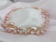 One Pretty baby pink baroque and white mixed pearls necklace.  Large pink baroque pearls shown with white rice pearls and small Dainty pink baby baroque pearls. The second necklace is of all baby pink baroque pearls..A lovely mix of quality natural  freshwaterpearls. A beautiful gift for your wife girlfriend sweetheart or just a new addition to your jewelry box.  These necklaces will be a staple for your feminine outfits. Ready to dispatch to you one or both, please specify..my handmade items ar Pink Baroque, Rice Pearls, Pink Pearl Necklace, Pearl Gifts, Baby Pearls, Artisan Necklace, Pearl Necklace Set, Feminine Outfits, White Pearl Necklace