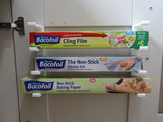 three different types of baking paper are hanging on the wall in front of a door