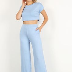 Solid Two Piece Pants Set Featuring A Short Sleeve Crop Top And High Waisted Wide Leg Pants With Pockets. Blue Stretch Cropped Bottoms, Casual Fitted Cropped Wide Leg Pants, Blue Stretch Sets With Pockets, Casual Spring Matching Set Bottoms, Blue High Waist Sets For Spring, Cotton Bottoms In Matching Set, Blue Trousers Sets For Spring, Fitted Cropped Blue Pants, Blue Cropped Cotton Pants