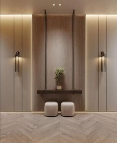 an empty room with two white stools and a plant in the corner on the wall