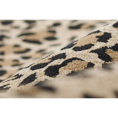 an animal print rug with black and white spots