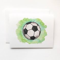 a watercolor painting of a soccer ball