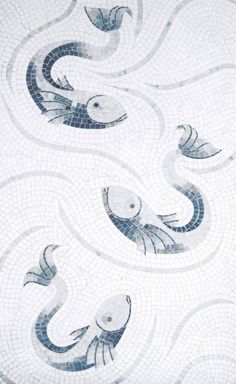 an artistic tile design with fish and waves