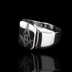 Be a part of the ultimate inner circle with this Stainless Steel Masonic Signet Ring. Its bold, distinctive Square and Compass symbol make a powerful statement of prestige and exclusivity. Wear it proudly into your next meeting or special occasion. Classic Adjustable Metal Rings, Adjustable Classic Metal Rings, Classic Stainless Steel Signet Ring For Formal Occasions, Classic Adjustable Stainless Steel Signet Ring, Classic Stainless Steel Promise Jewelry, Adjustable Stainless Steel Rings For Formal Occasions, Adjustable Symbolic Rings With Polished Finish, Modern Adjustable Engraved Ring For Formal Occasions, Silver Adjustable Initial Ring For Formal Occasions