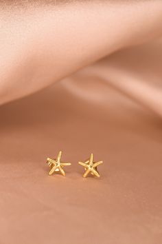 The Marina studs are the perfect starfish stud to complete your summer look. These beachy studs are gorgeous golden classics that are perfect for any ear stack! -24K Gold Filled studs -Sold as a pair Gold Star Earrings For Summer, Earring Stack, Star Fish, Ear Stack, Summer Look, Summer Looks, Starfish, Gold Filled, Gold Necklace